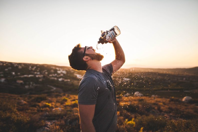 Drink water while hot weather hiking